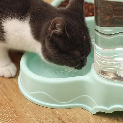 a cat drinking water in a dispenser